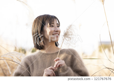 Woman enjoying a walk in nature 121767676