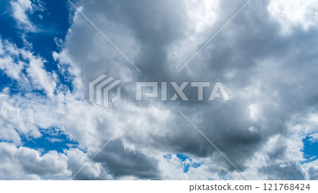 Many white clouds flowing in the midsummer blue sky 121768424