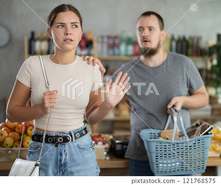 Angry girl turned away from husband during quarrel, he want to make peace after quarrel, calm wife 121768575