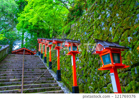 Kurama Temple's offering lanterns, fresh greenery and stone steps 121769376