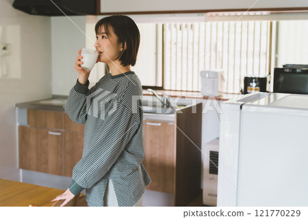 First thing in the morning: milk and a woman 121770229
