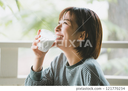 Morning milk and woman 121770234