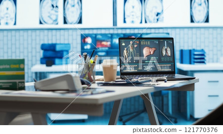 Empty doctor office featuring modern medical equipment and drugs, ready for the next patient consultation. Highlighting advanced diagnostics, healthcare services and patient care management. 121770376