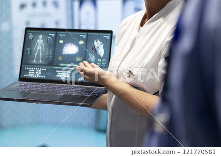 Medical staff analyzing heart x ray scan test results to discuss treatment plan for disease prevention. Group of licensed experts examining cardiovascular issues on a ecg radiography. Close up. Medical staff analyzing heart x ray scan test results to discuss treatment plan for disease prevention. Group of licensed experts examining cardiovascular issues on a ecg radiography. Close up. 121770581