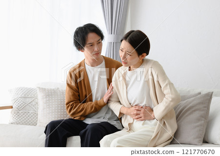A woman in poor health and a man who cares for her A woman in poor health and a man who cares for her 121770670