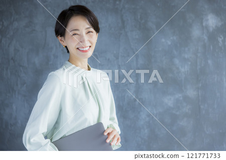 A woman with a laptop A woman with a laptop 121771733