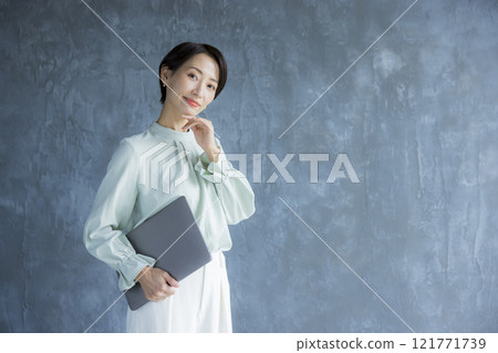 A woman with a laptop A woman with a laptop 121771739