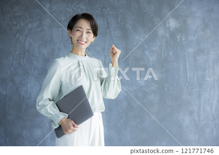 A woman with a laptop A woman with a laptop 121771746