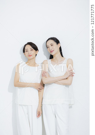 Two cuddling women 121771775