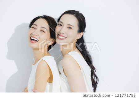 Two cuddling women 121771782