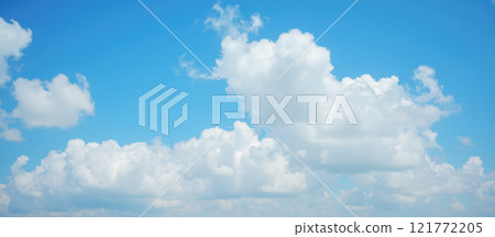Beautiful bright blue sky filled with fluffy white clouds, calm and clear summer day, natural cloudscape scene, soft and peaceful outdoor view, tranquil atmosphere, serene weather Beautiful bright blue sky filled with fluffy white clouds, calm and clear summer day, natural cloudscape scene, soft and peaceful outdoor view, tranquil atmosphere, serene weather 121772205
