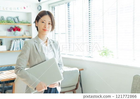Young woman working in a designer office 121772866