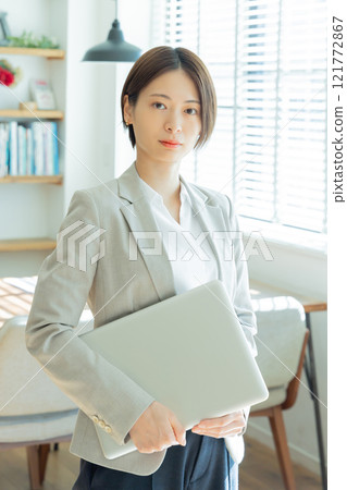 Young woman working in a designer office 121772867