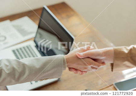 Two businessmen shaking hands Two businessmen shaking hands 121772920