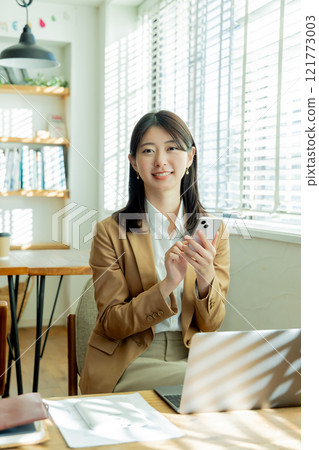 Woman working in coworking space Woman working in coworking space 121773003