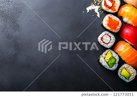 A world map crafted from sushi rolls, where different regions are represented by distinct ingredient 121773051