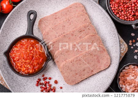 Delicious canned pink spiced ham or spam with salt, spices and herbs Delicious canned pink spiced ham or spam with salt, spices and herbs 121775879