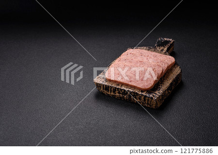 Delicious canned pink spiced ham or spam with salt, spices and herbs Delicious canned pink spiced ham or spam with salt, spices and herbs 121775886