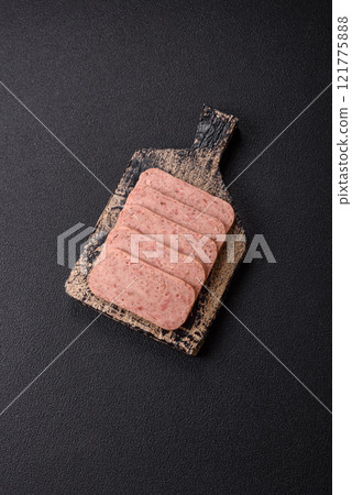 Delicious canned pink spiced ham or spam with salt, spices and herbs Delicious canned pink spiced ham or spam with salt, spices and herbs 121775888