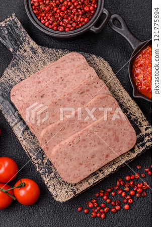 Delicious canned pink spiced ham or spam with salt, spices and herbs 121775894
