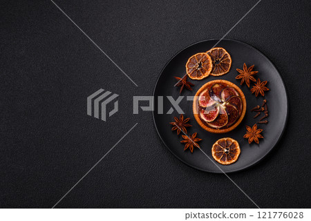 Sweet tart with figs, cheese cream and pecans 121776028