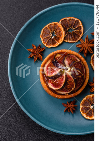 Sweet tart with figs, cheese cream and pecans 121776044