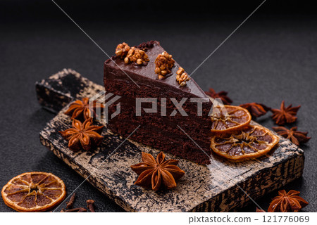 Piece of sweet chocolate cake with nuts Piece of sweet chocolate cake with nuts 121776069