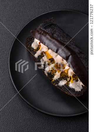 Sandwich with brioche bun, roast beef and vitello tonato sauce 121776237