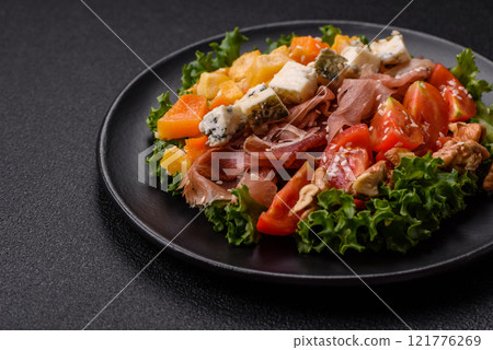Appetizing salad with prosciutto, pumpkin, cheese and tomatoes Appetizing salad with prosciutto, pumpkin, cheese and tomatoes 121776269