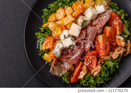 Appetizing salad with prosciutto, pumpkin, cheese and tomatoes Appetizing salad with prosciutto, pumpkin, cheese and tomatoes 121776270