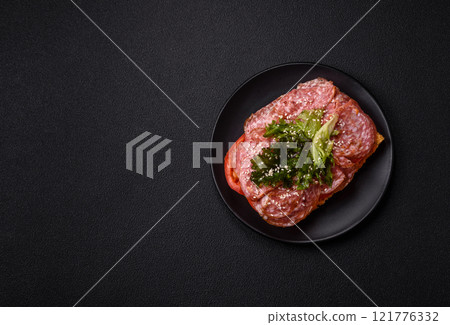 Focaccia with salami, cheese, tomatoes, arugula, salt, spices and herbs 121776332