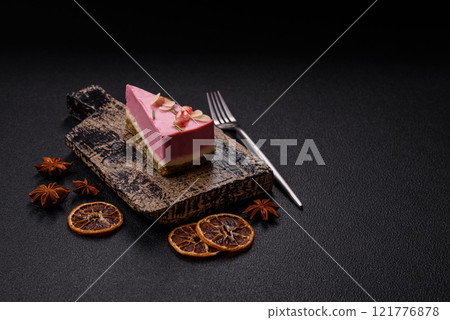 Piece of sweet cheesecake with pink cream cheese of raspberry or strawberry flavor Piece of sweet cheesecake with pink cream cheese of raspberry or strawberry flavor 121776878