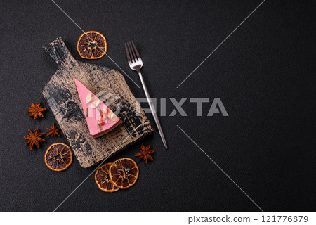 Piece of sweet cheesecake with pink cream cheese of raspberry or strawberry flavor Piece of sweet cheesecake with pink cream cheese of raspberry or strawberry flavor 121776879
