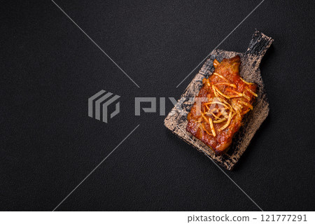Pork or beef ribs with salt, spices and herbs baked on the grill 121777291