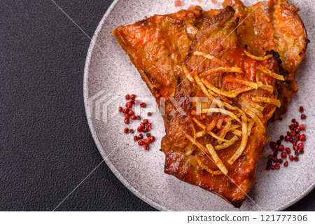 Pork or beef ribs with salt, spices and herbs baked on the grill 121777306