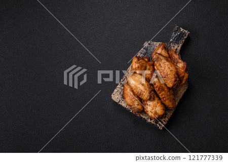 Grilled chicken wings with salt, spices and herbs 121777339