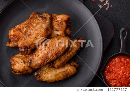 Grilled chicken wings with salt, spices and herbs 121777357