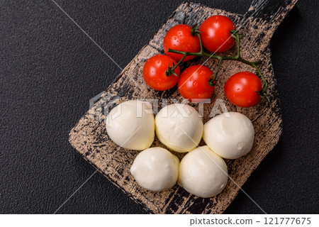 Delicious fresh mozzarella cheese with tomatoes, salt and spices 121777675