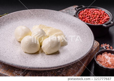 Delicious fresh mozzarella cheese with tomatoes, salt and spices 121777687