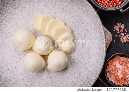 Delicious fresh mozzarella cheese with tomatoes, salt and spices 121777688