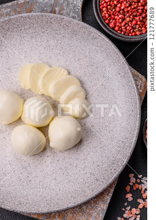 Delicious fresh mozzarella cheese with tomatoes, salt and spices 121777689