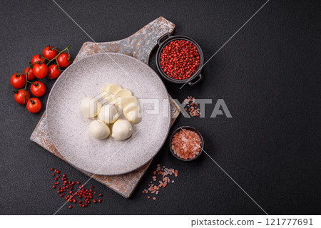 Delicious fresh mozzarella cheese with tomatoes, salt and spices 121777691
