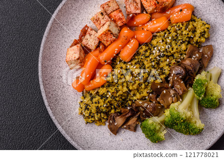 Colorful vegan vegetarian dish consists of tofu, broccoli, quinoa, mushrooms Colorful vegan vegetarian dish consists of tofu, broccoli, quinoa, mushrooms 121778021