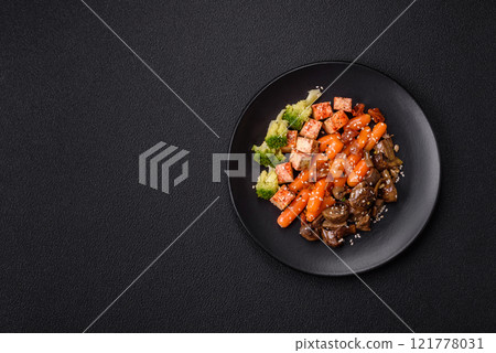 Colorful vegan vegetarian dish consists of tofu, broccoli, quinoa, mushrooms 121778031