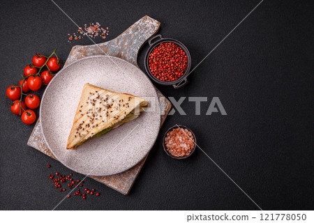 Sandwich with toast bread, meat, tomatoes, cheese, sauce, salt and spices Sandwich with toast bread, meat, tomatoes, cheese, sauce, salt and spices 121778050