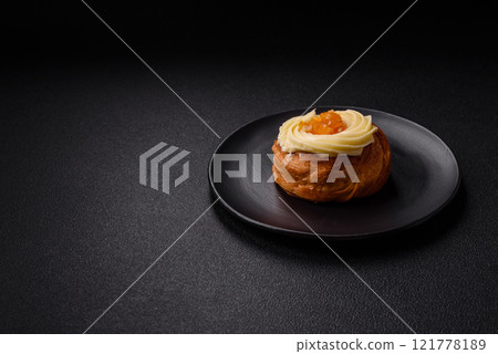 Sweet dessert danish with raisins, cream and pear filling Sweet dessert danish with raisins, cream and pear filling 121778189