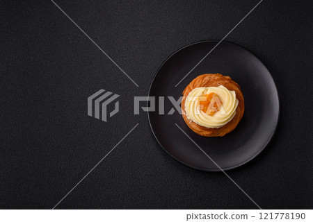 Sweet dessert danish with raisins, cream and pear filling Sweet dessert danish with raisins, cream and pear filling 121778190