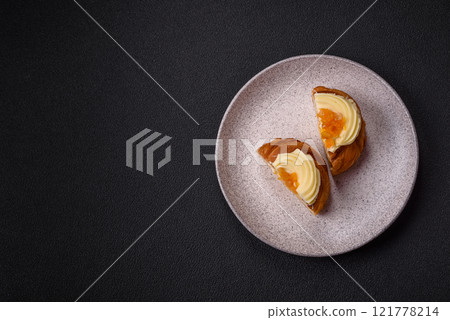 Sweet dessert danish with raisins, cream and pear filling 121778214