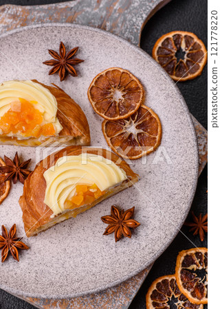 Sweet dessert danish with raisins, cream and pear filling Sweet dessert danish with raisins, cream and pear filling 121778220