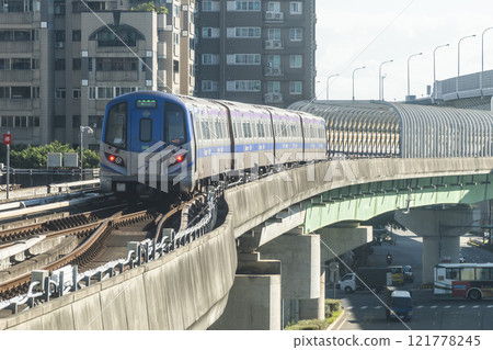 View of a Taoyuan International Airport line train running on the elevated track of the Taoyuan Mass Rapid Transit System. 121778245